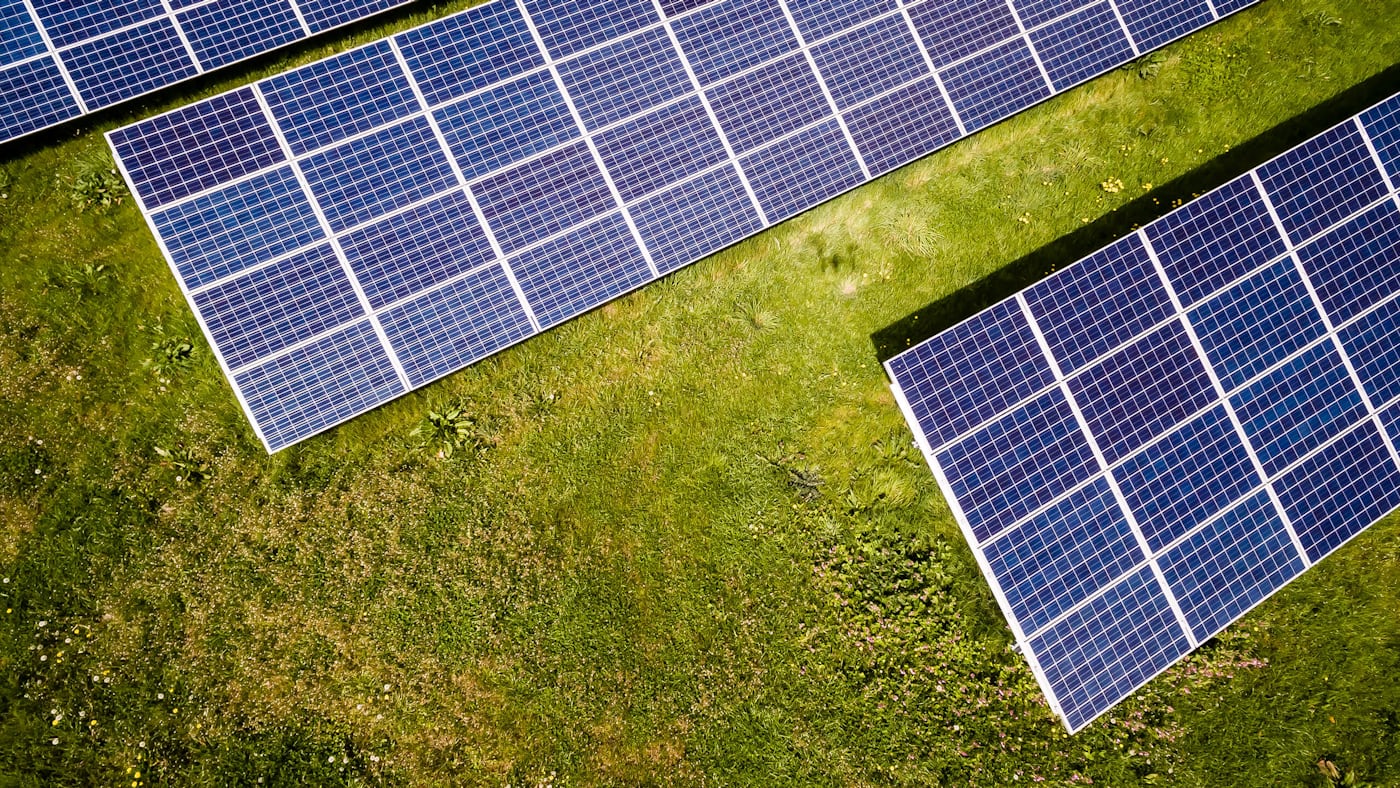 Photovoltaic solar panels above a green meadow in inland Spain
